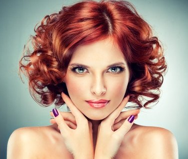 Beautiful model red with curly hair
